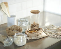 Ingredients and wooden utensils in plastic-free, zero-waste kitchen